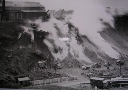 Removing bank to quench fire.